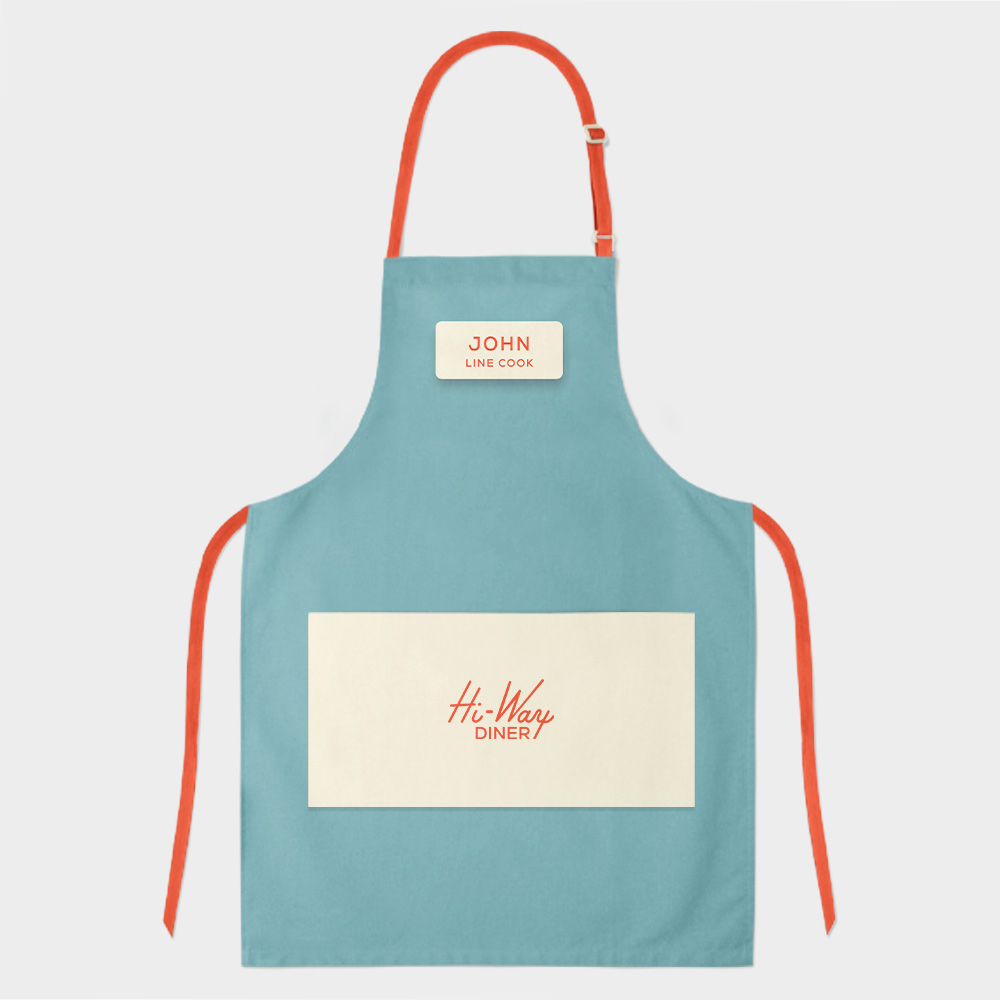 Blue Hi-Way Diner apron with coral ties. Logo and nametag located on the front.